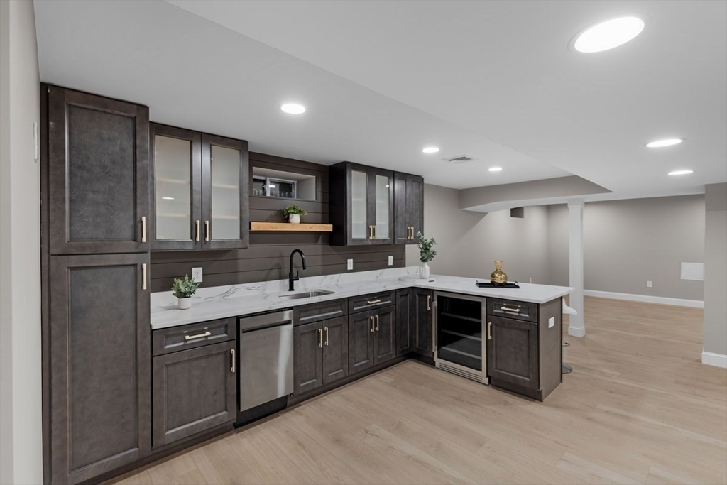 Lot 12 Brookside Lane Norfolk, MA 02056 - Photo 35 of 42 a large kitchen with cabinets and stainless steel appliances