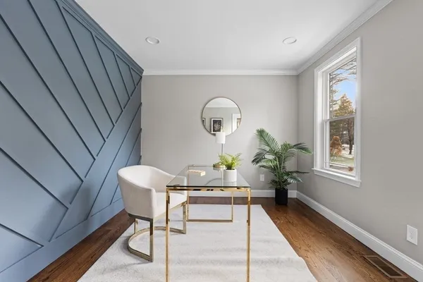 a dining room with furniture and window