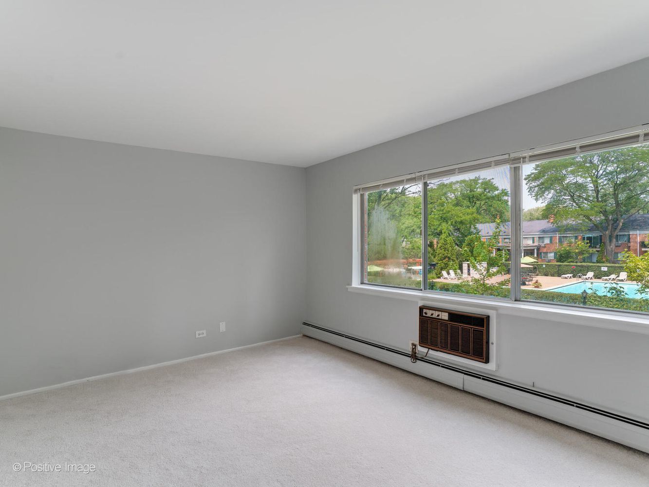2407 South Goebbert Road, Unit 201 Arlington Heights, IL 60005 - Photo 13 of 22 an empty room with a window