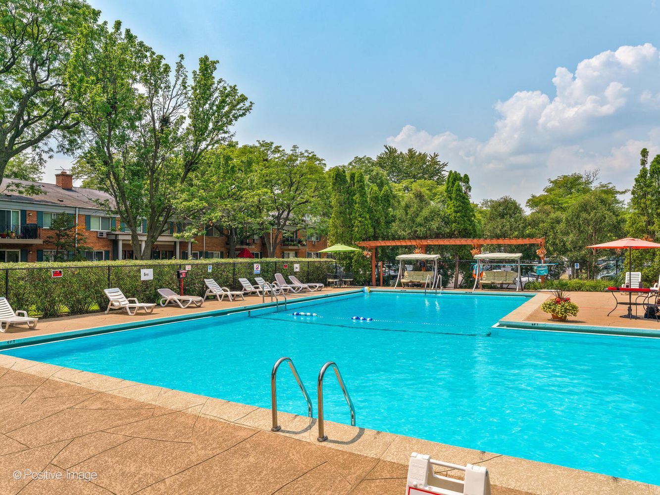 2407 South Goebbert Road, Unit 201 Arlington Heights, IL 60005 - Photo 22 of 22 a view of a house with a swimming pool