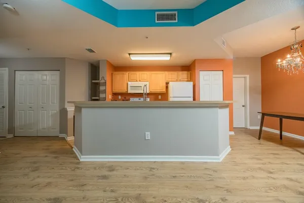 a view of a kitchen and a window