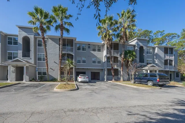 a view of the house with potted plants