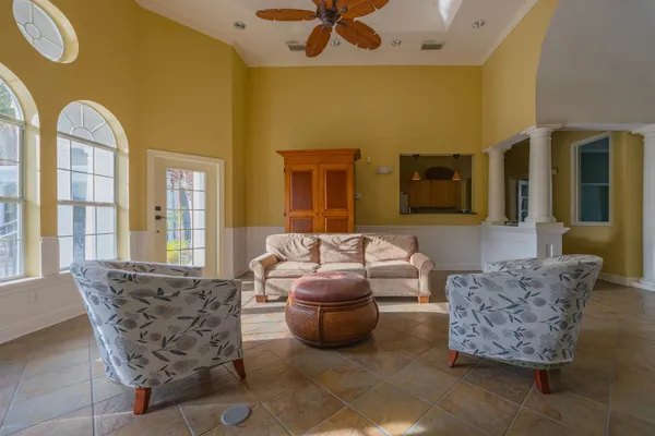 a view of a lounge chairs with a patio