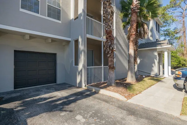 a front view of a house with a garage