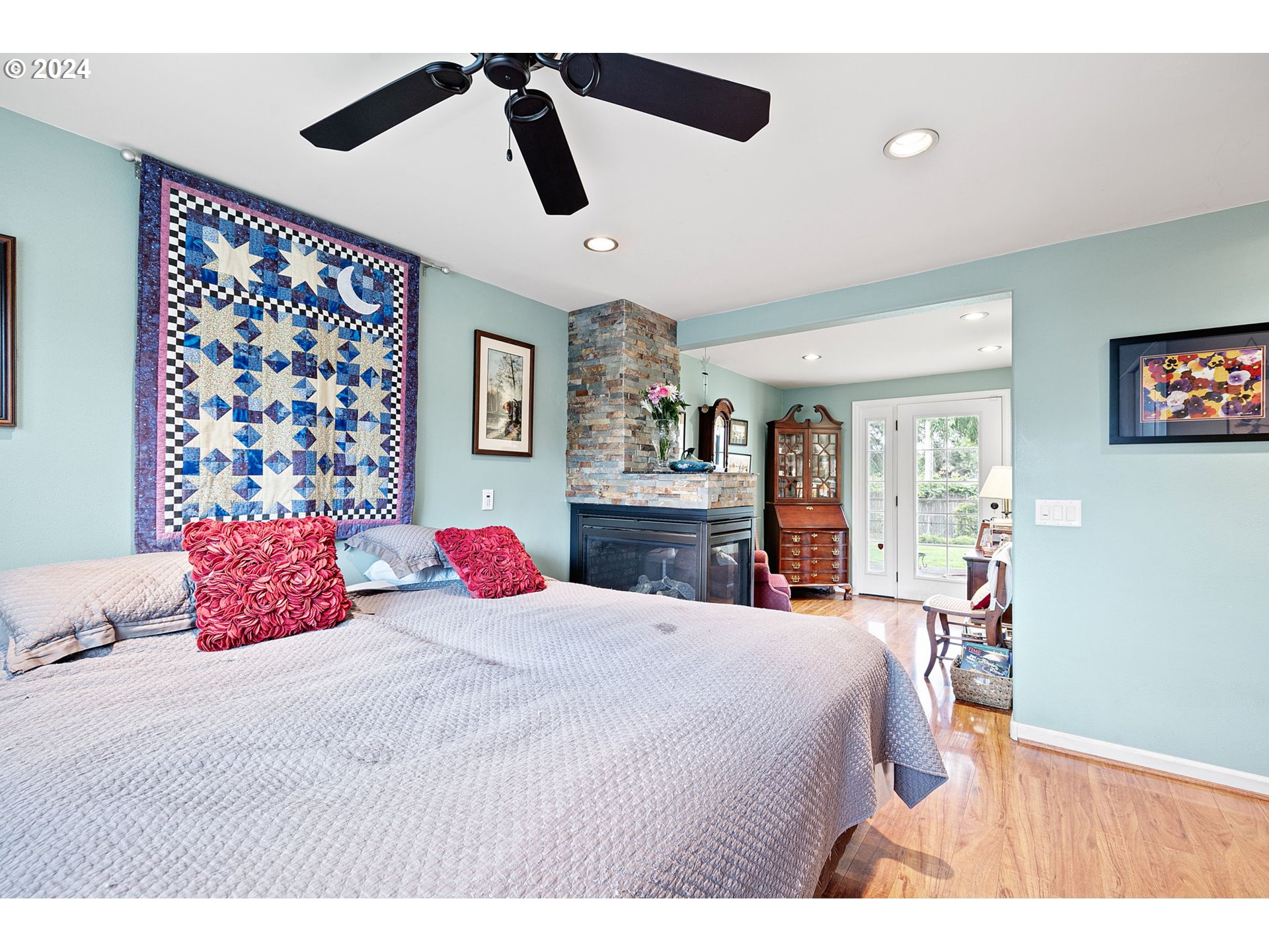 2990 Hyacinth Street Eugene, OR 97404 - Photo 12 of 47 a bedroom with a bed and a chandelier