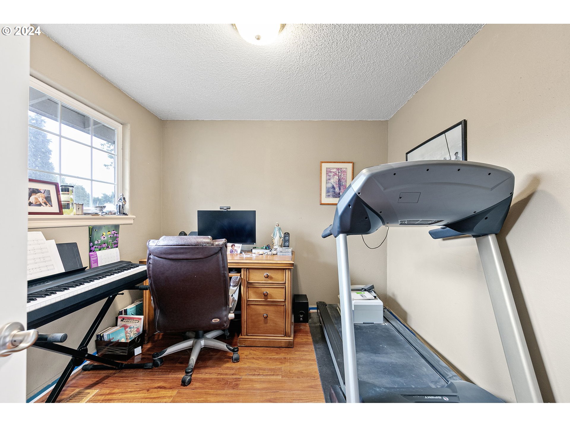 2990 Hyacinth Street Eugene, OR 97404 - Photo 18 of 47 a view of a workspace with furniture and a window