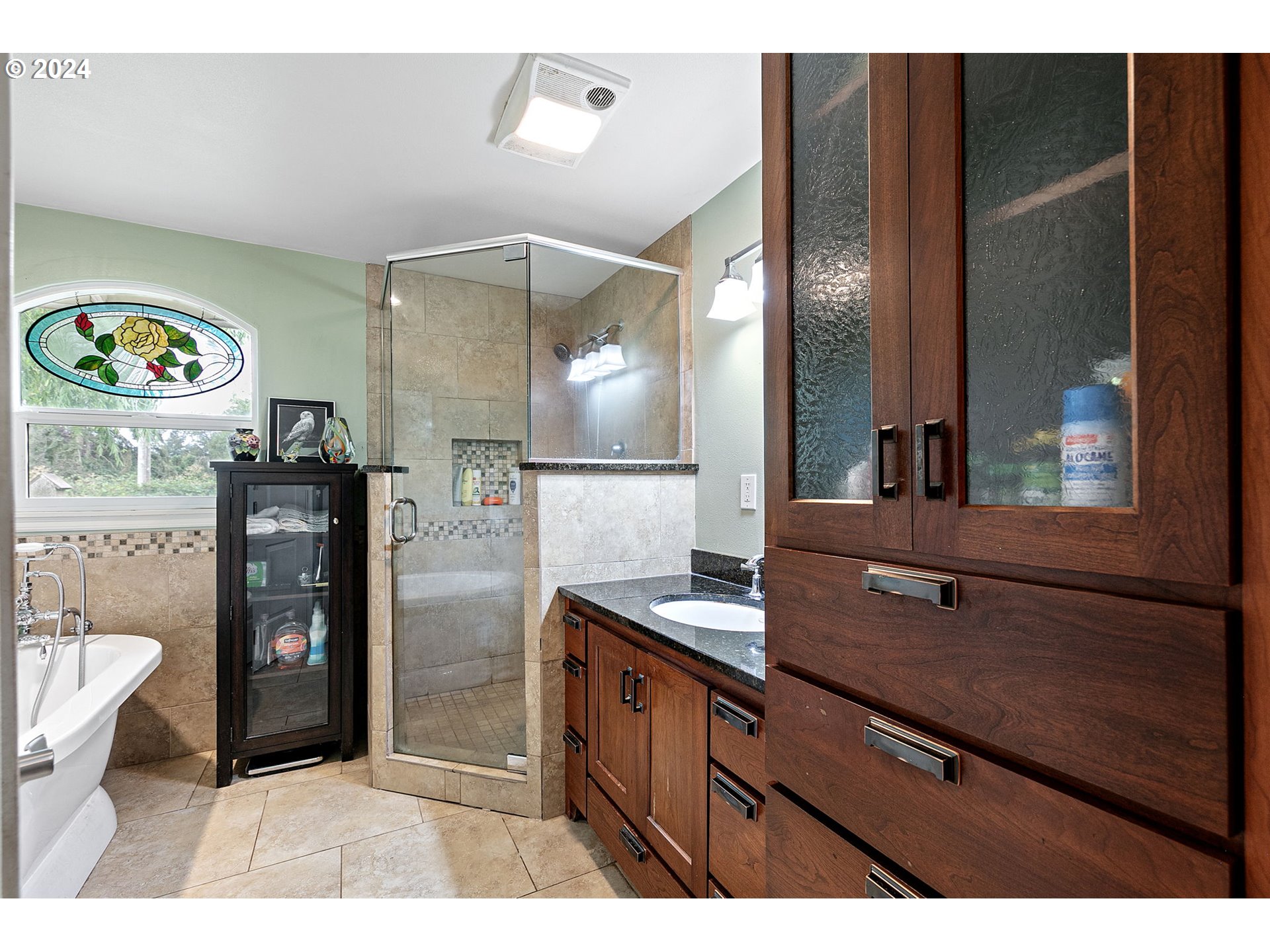 2990 Hyacinth Street Eugene, OR 97404 - Photo 19 of 47 a bathroom with a sink a mirror and a shower