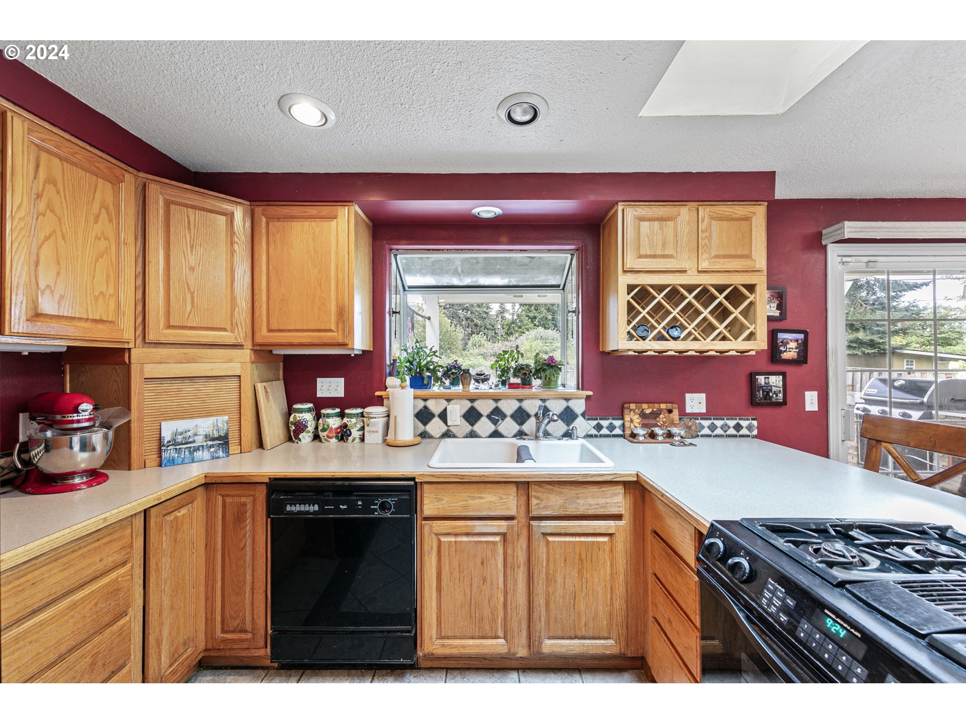 2990 Hyacinth Street Eugene, OR 97404 - Photo 25 of 47 a kitchen with a stove a sink and a refrigerator
