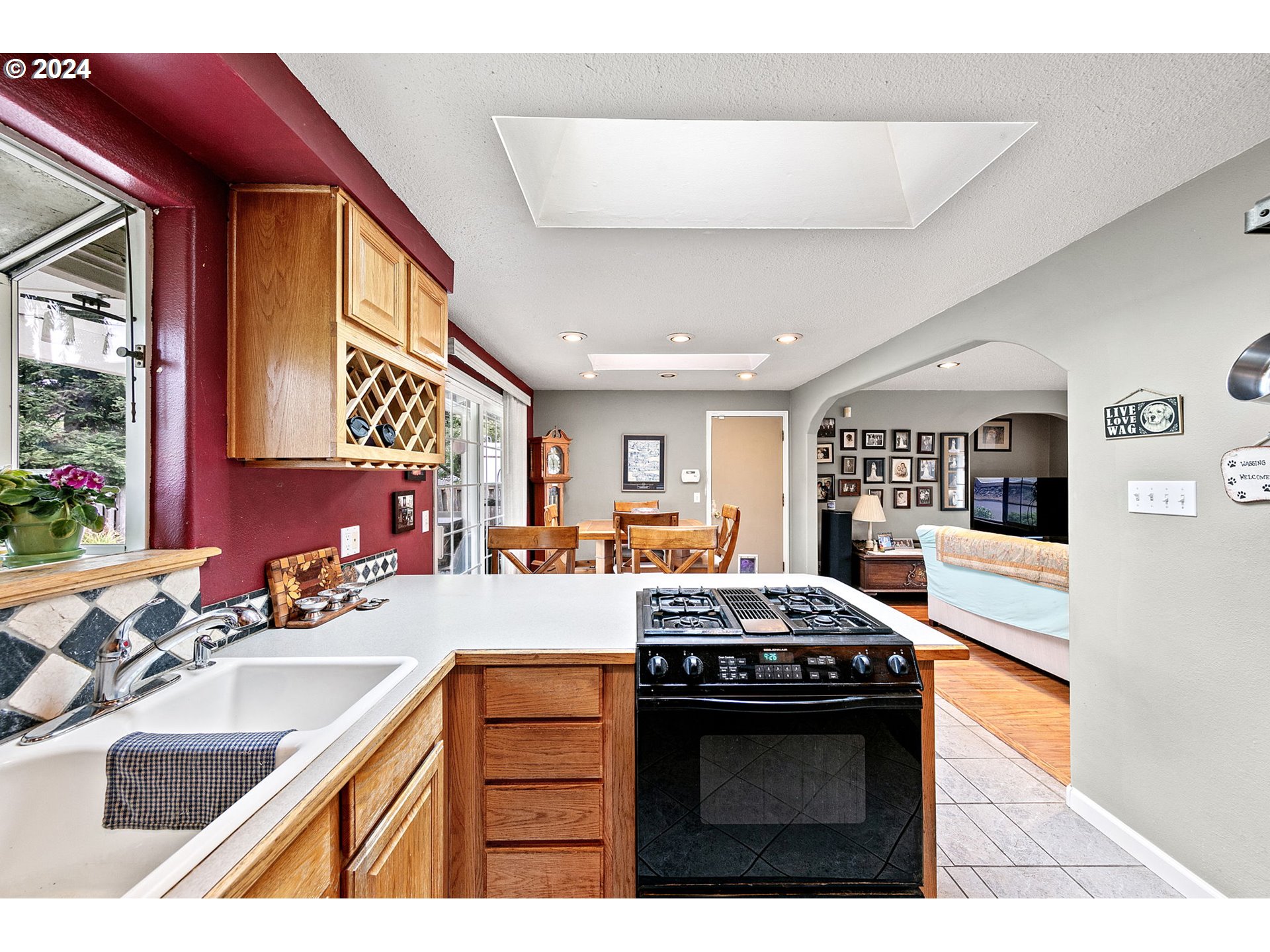2990 Hyacinth Street Eugene, OR 97404 - Photo 28 of 47 a kitchen with stainless steel appliances granite countertop a sink stove and cabinets