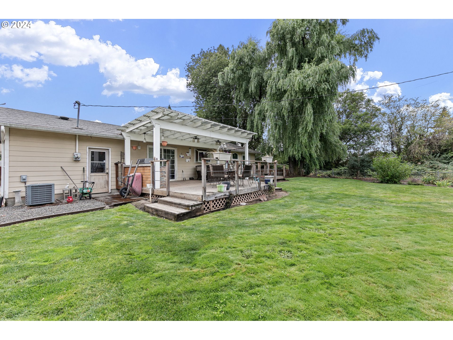 2990 Hyacinth Street Eugene, OR 97404 - Photo 38 of 47 a view of a house with backyard porch and sitting area