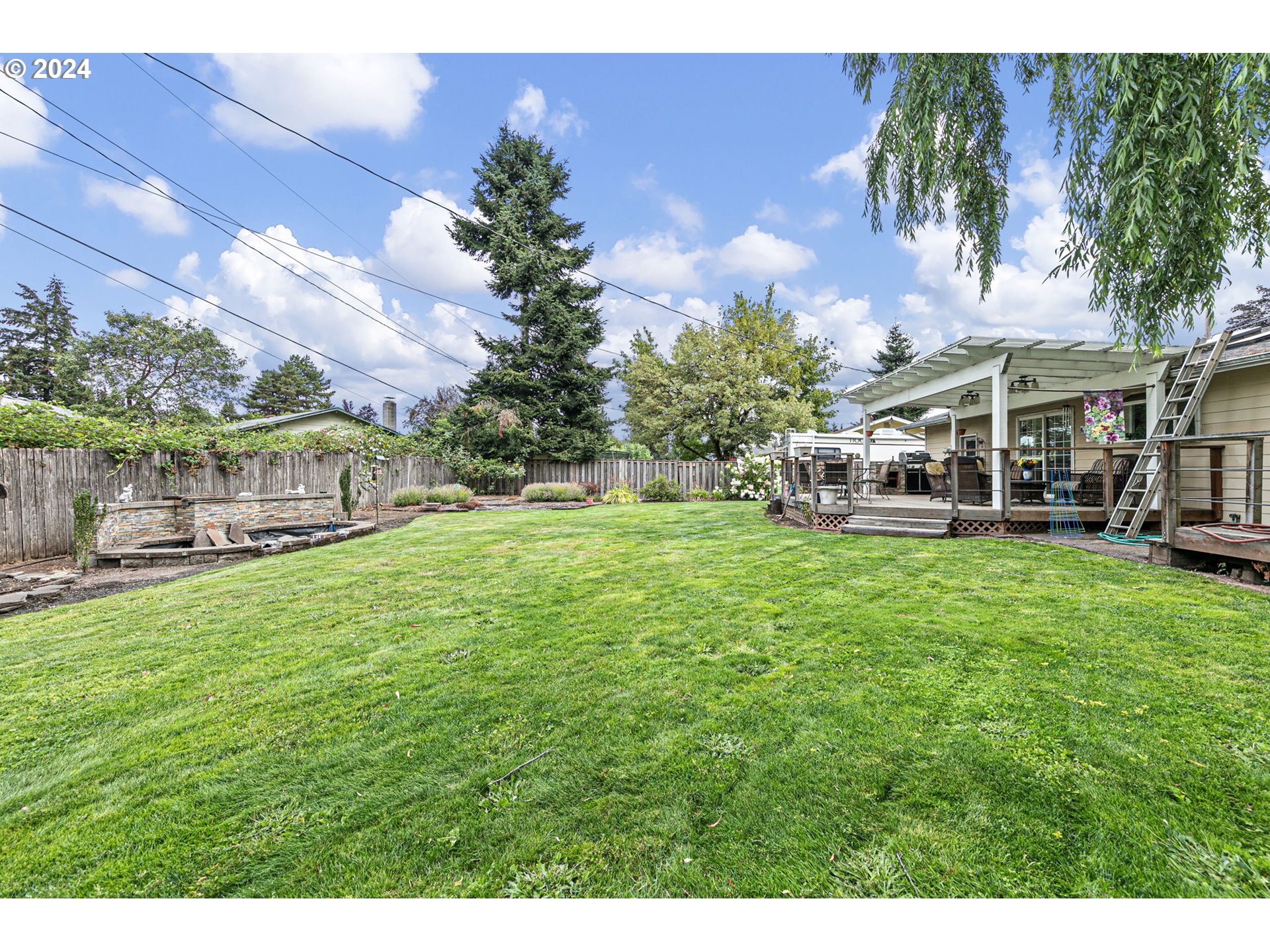 2990 Hyacinth Street Eugene, OR 97404 - Photo 43 of 47 a view of house with garden space and trees