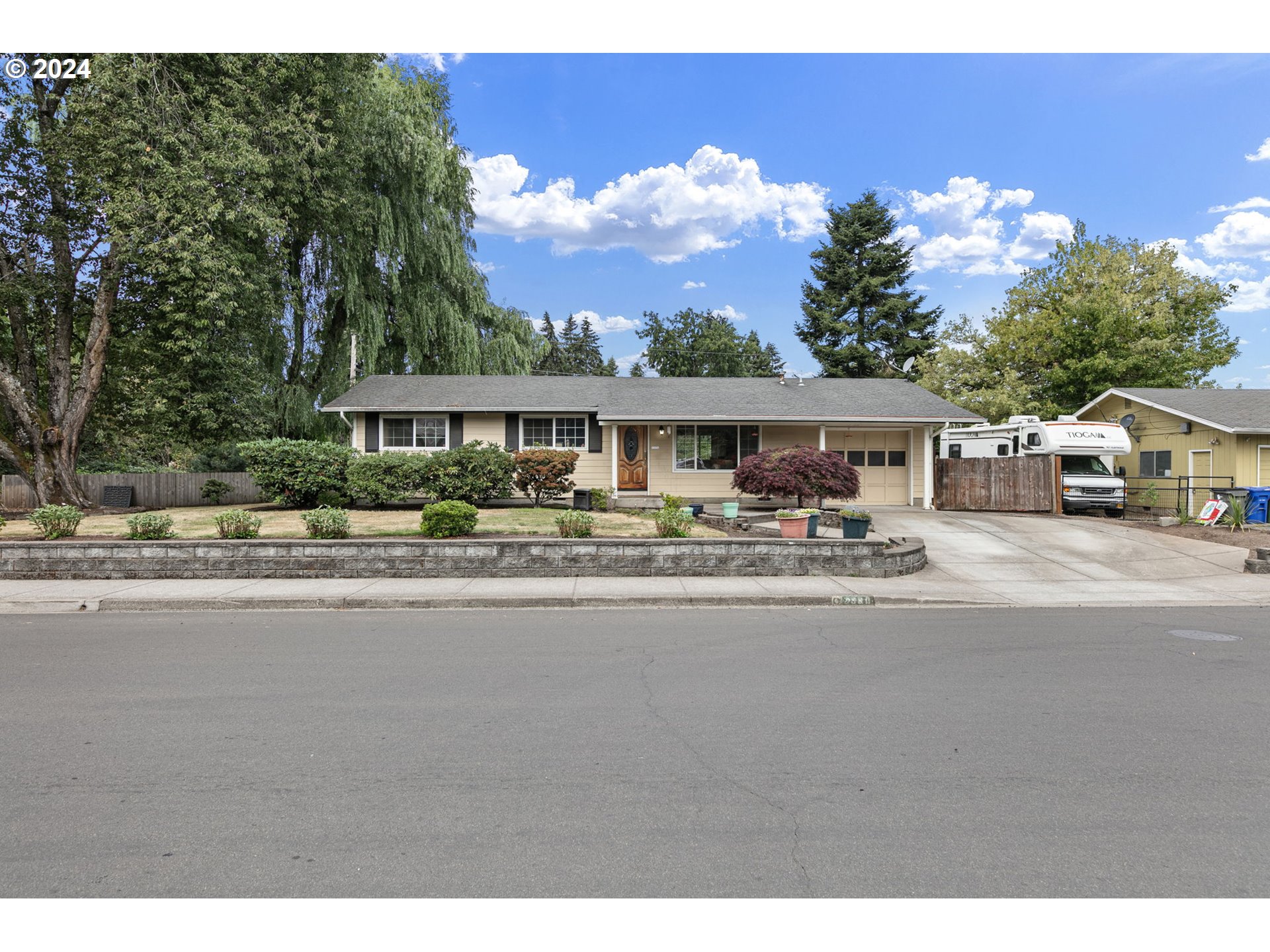 2990 Hyacinth Street Eugene, OR 97404 - Photo 45 of 47 a front view of a house with a garden and lake view