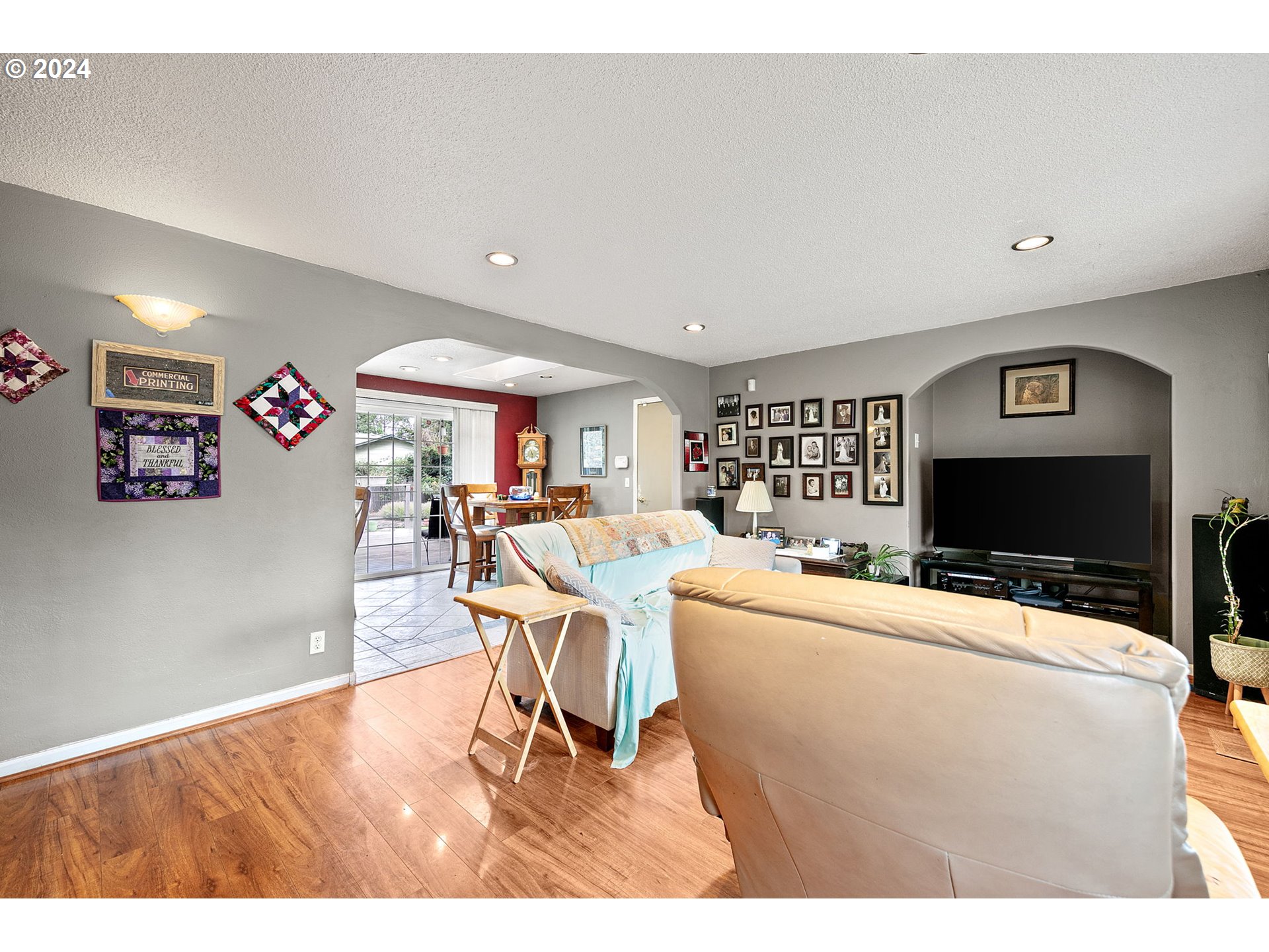 2990 Hyacinth Street Eugene, OR 97404 - Photo 7 of 47 a living room with furniture a flat screen tv and a table