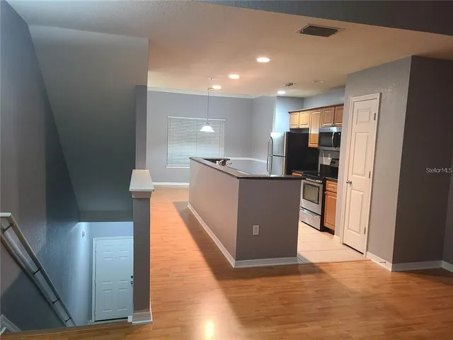 a view of kitchen with wooden floor