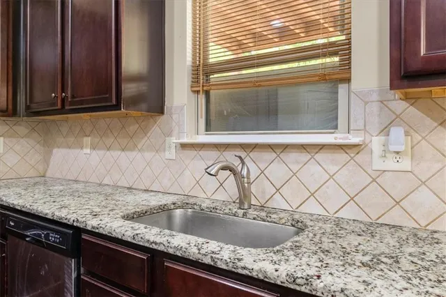 a stove top oven sitting inside of a kitchen