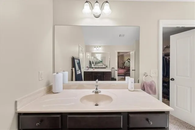 a bathroom with a bathtub and a window