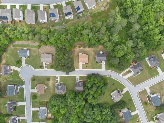 an aerial view of residential house with outdoor space