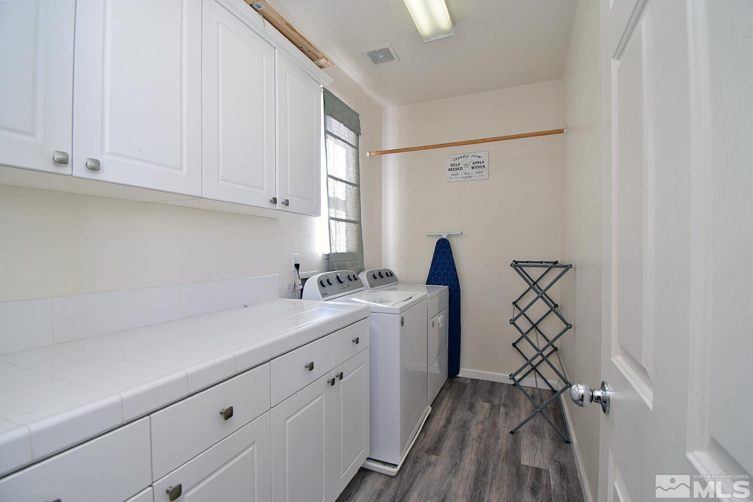 9335 Hummer Court Reno, NV 89521 - Photo 17 of 24 a room with a sink a washer and dryer
