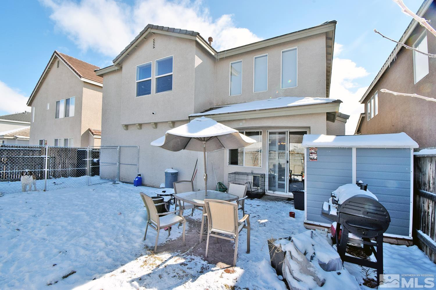 9335 Hummer Court Reno, NV 89521 - Photo 20 of 24 a backyard of a house with seating space