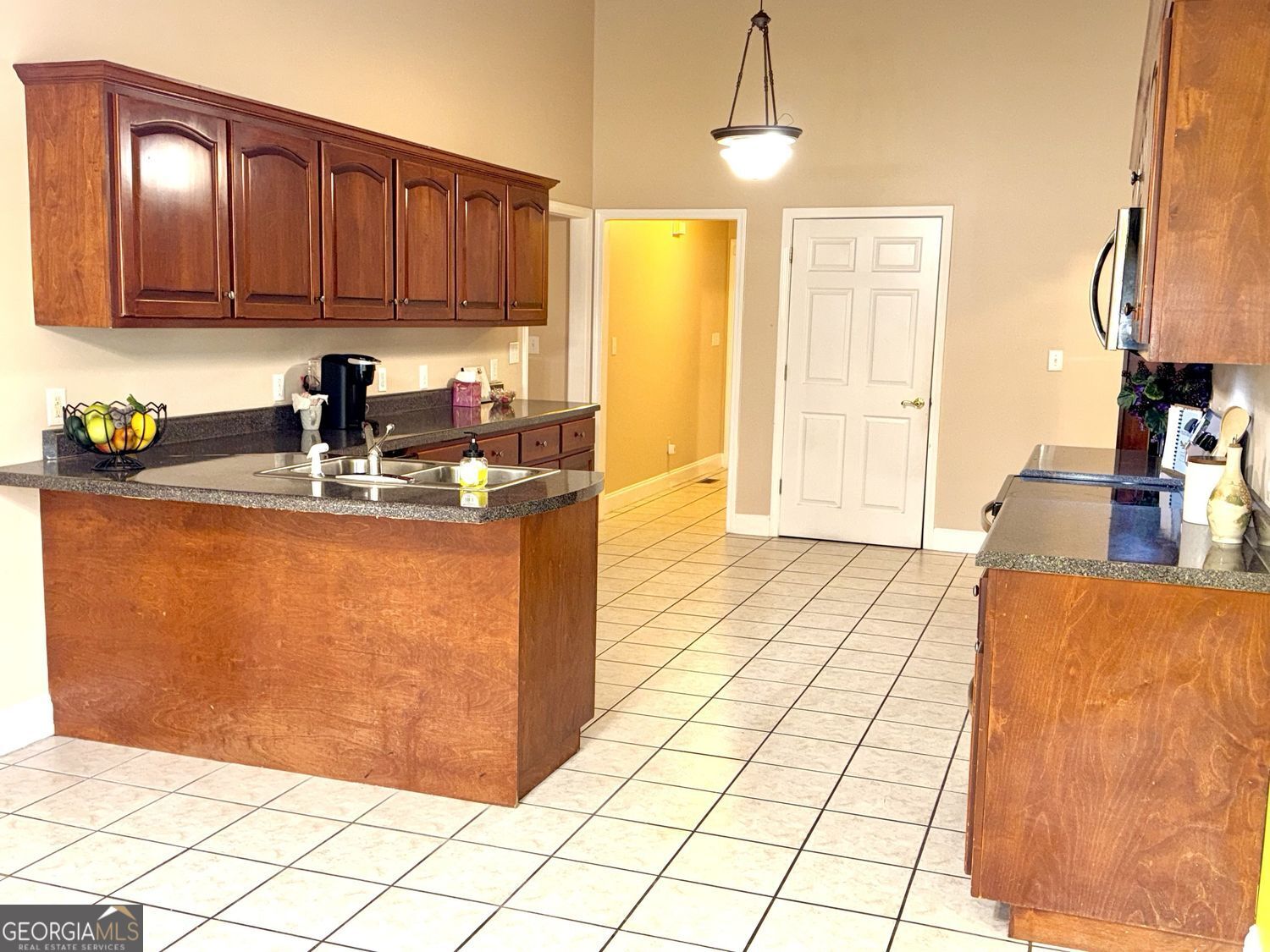 229 Lite-N-Tie Road Gray, GA 31032 - Photo 11 of 21 a kitchen with stainless steel appliances granite countertop a stove a sink and a cabinets