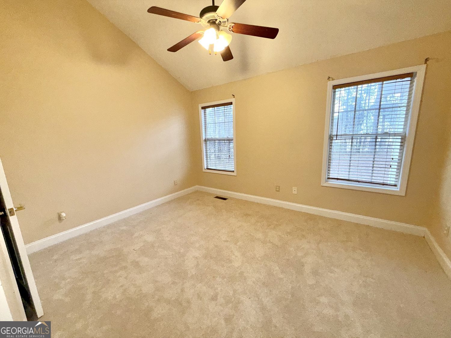 229 Lite-N-Tie Road Gray, GA 31032 - Photo 15 of 21 an empty room with windows and fan