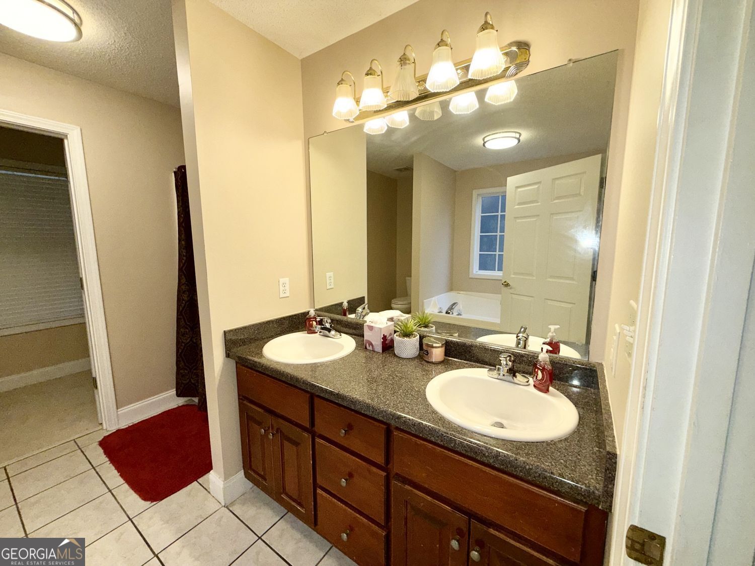 229 Lite-N-Tie Road Gray, GA 31032 - Photo 18 of 21 a bathroom with a granite countertop sink and a mirror