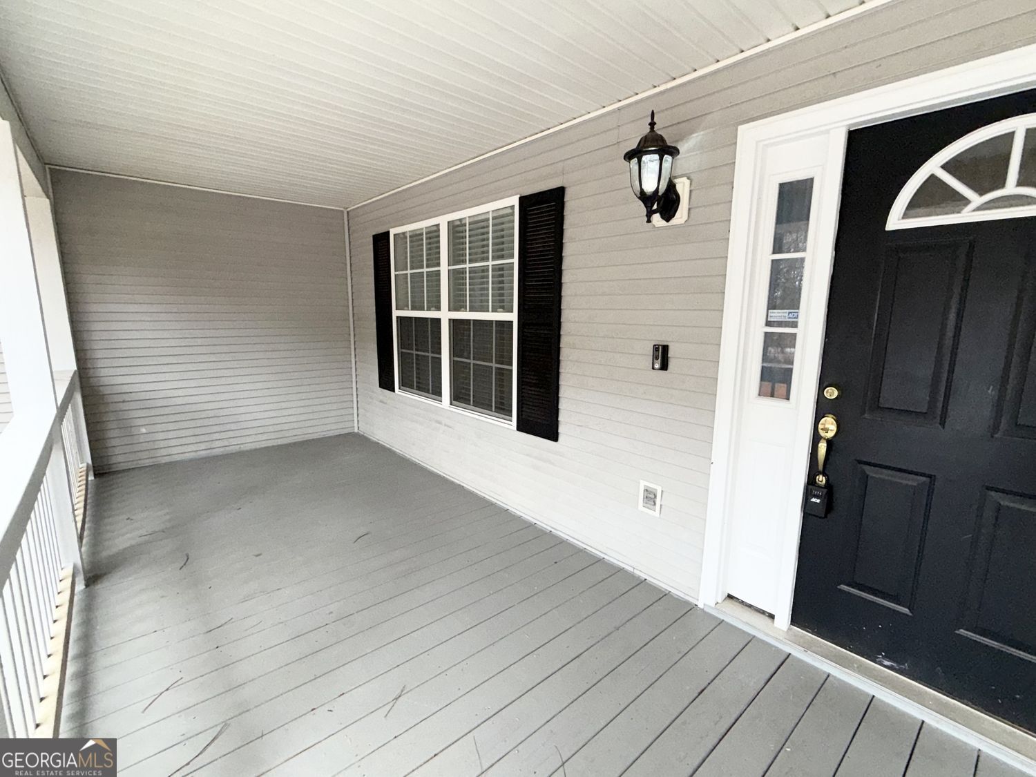 229 Lite-N-Tie Road Gray, GA 31032 - Photo 3 of 21 a view of an empty room with wooden floor and a window