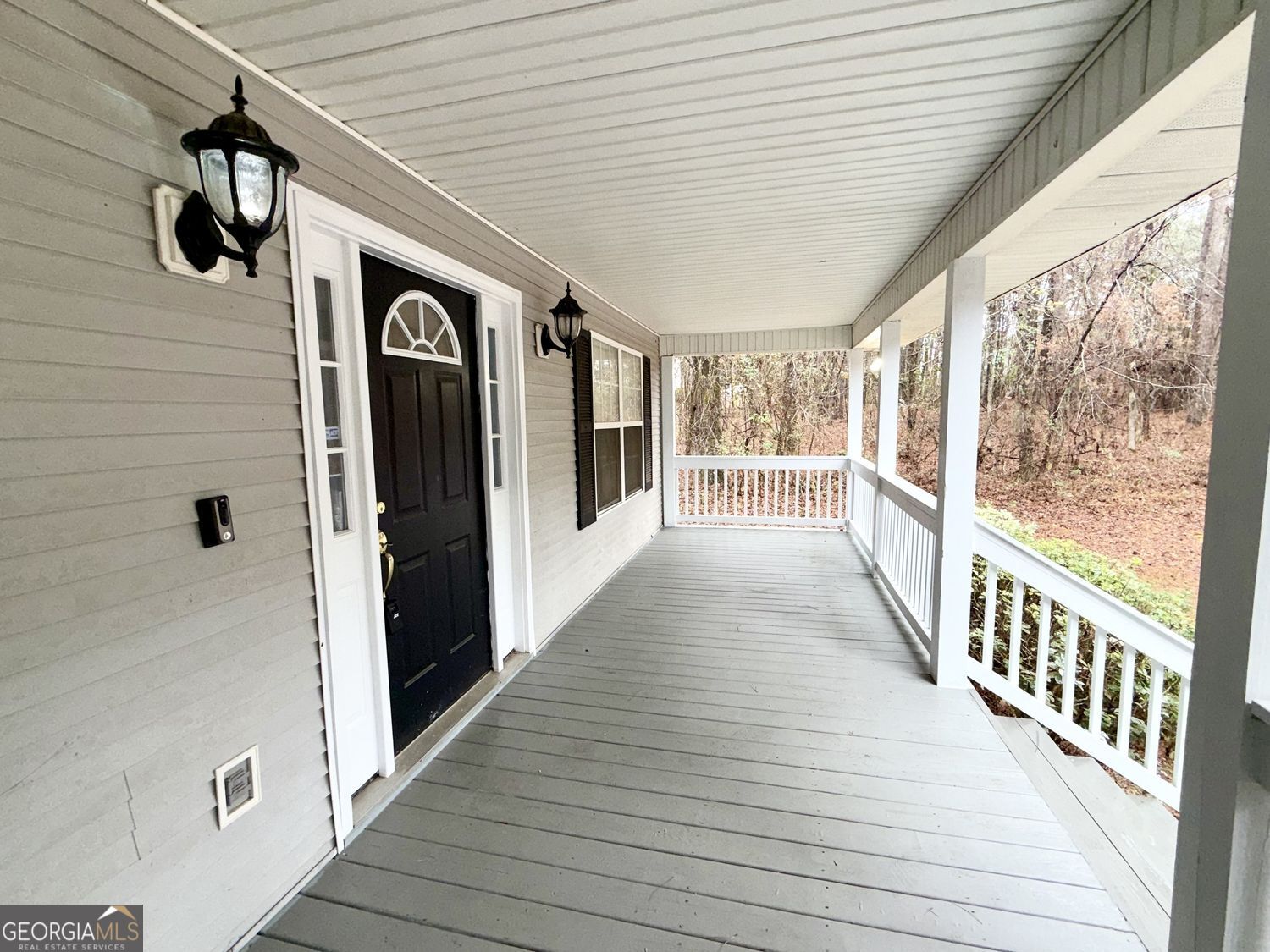 229 Lite-N-Tie Road Gray, GA 31032 - Photo 4 of 21 a view of a hallway with wooden floor and staircase