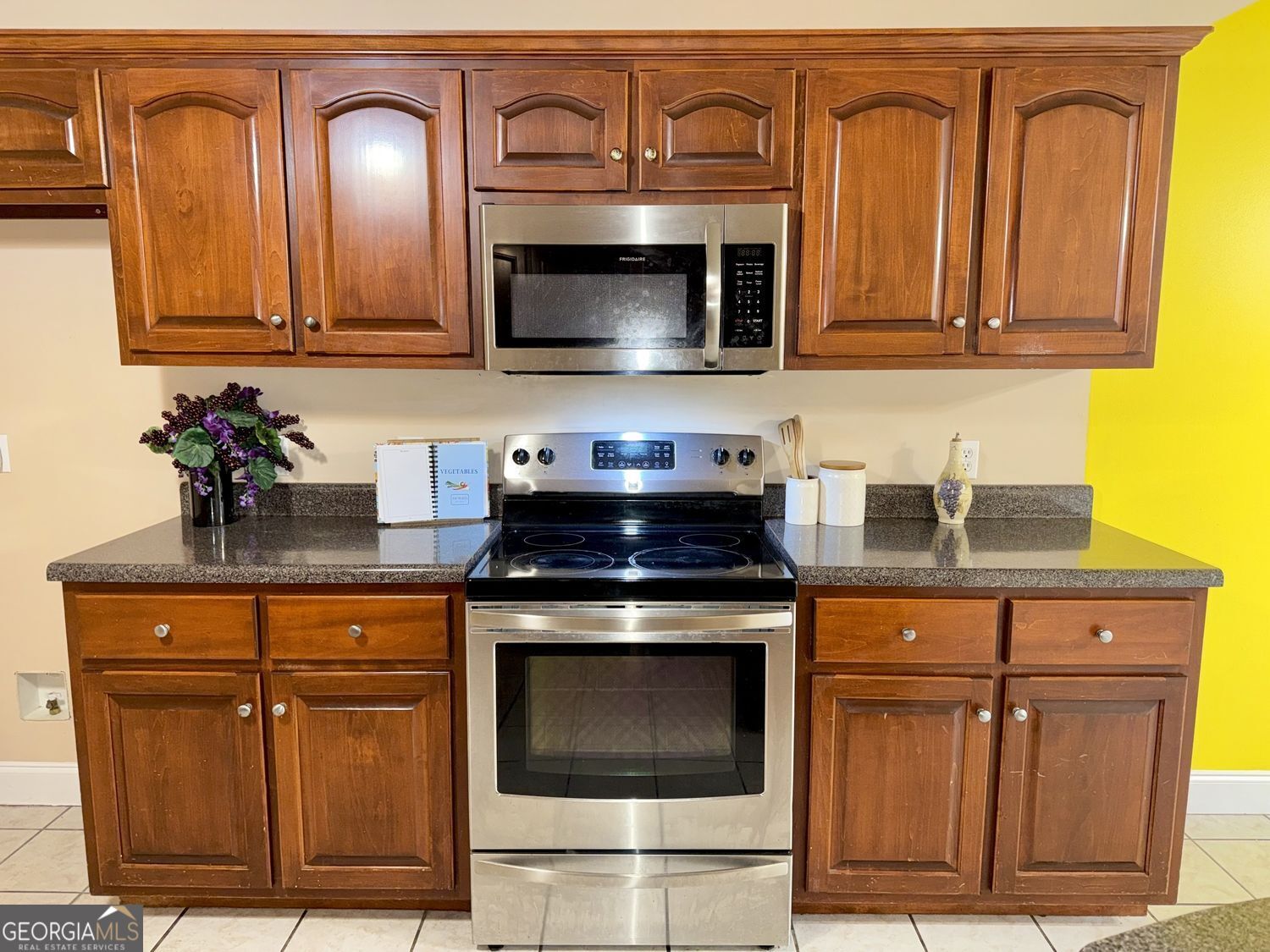 229 Lite-N-Tie Road Gray, GA 31032 - Photo 9 of 21 a kitchen with granite countertop wood cabinets stainless steel appliances and a sink