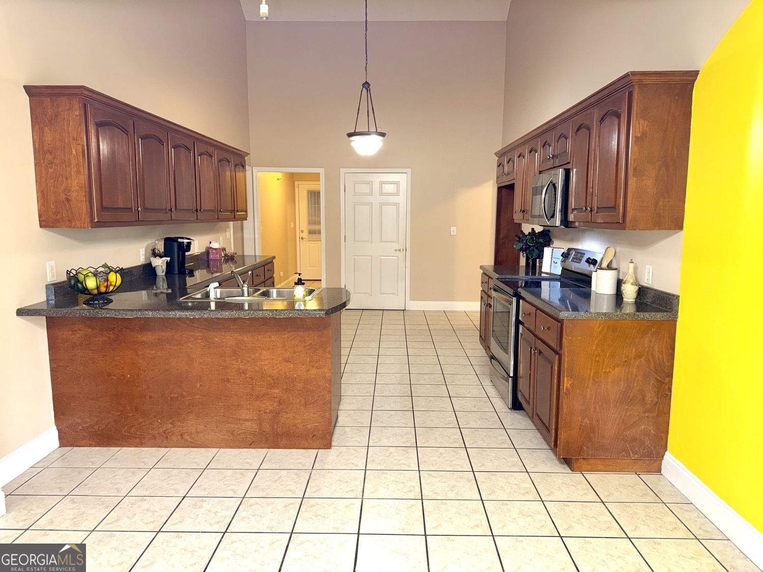 229 Lite-N-Tie Road Gray, GA 31032 - Photo 10 of 21 a kitchen with stainless steel appliances granite countertop a refrigerator a stove top oven and a cabinets