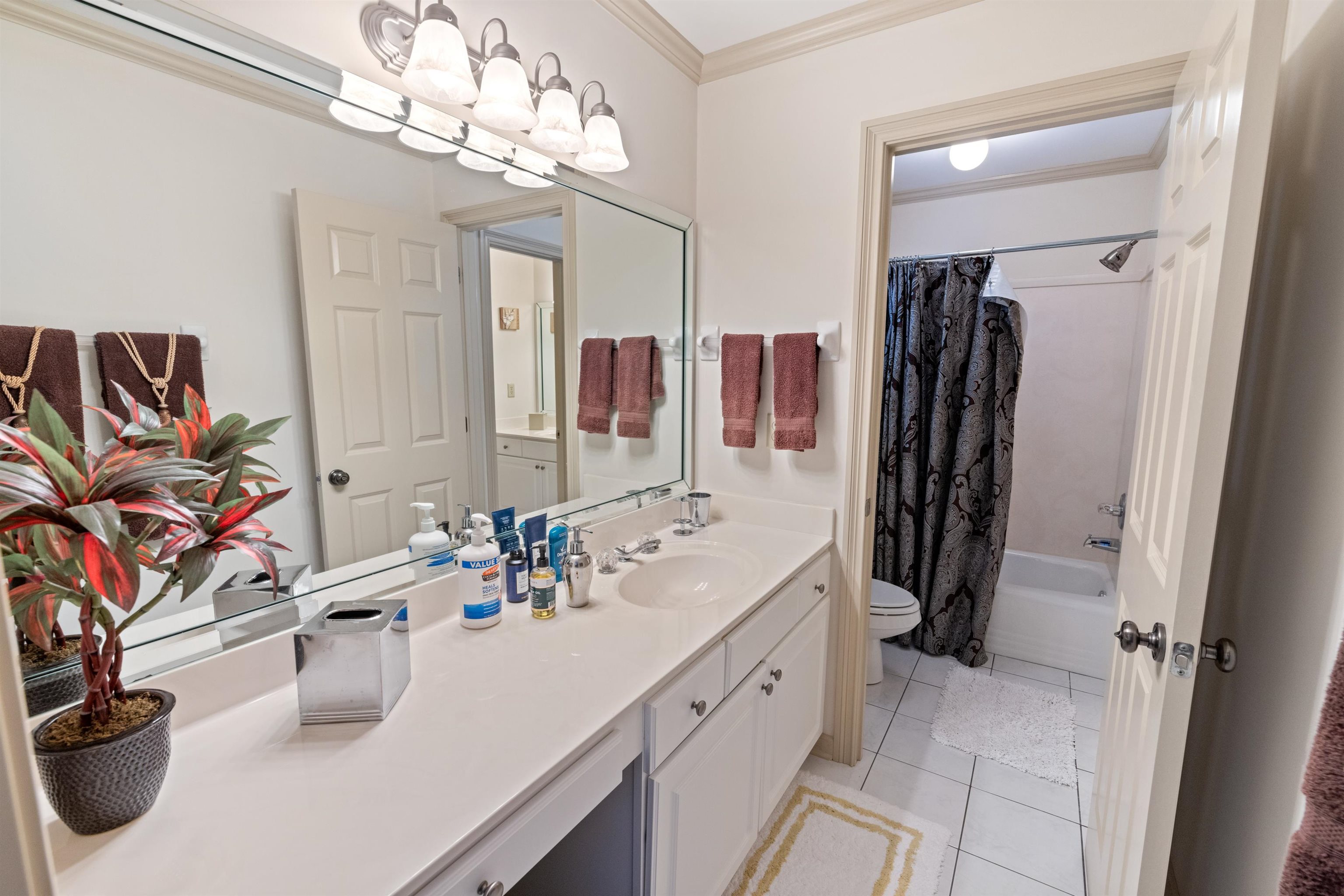 11241 Latting Road Eads, TN 38028 - Photo 26 of 31 Full bathroom featuring shower / tub combo, vanity, crown molding, toilet, and tile patterned floors
