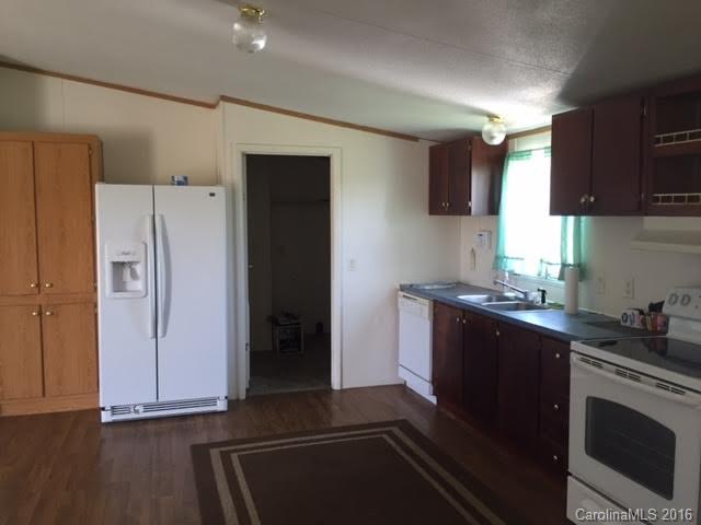 4365 Tite Road Stanfield, NC 28163 - Photo 12 of 22 a kitchen with stainless steel appliances a refrigerator stove and sink
