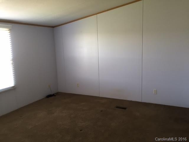 4365 Tite Road Stanfield, NC 28163 - Photo 14 of 22 an empty room with a empty space and window