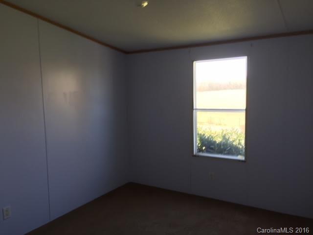 4365 Tite Road Stanfield, NC 28163 - Photo 17 of 22 an empty room with a window