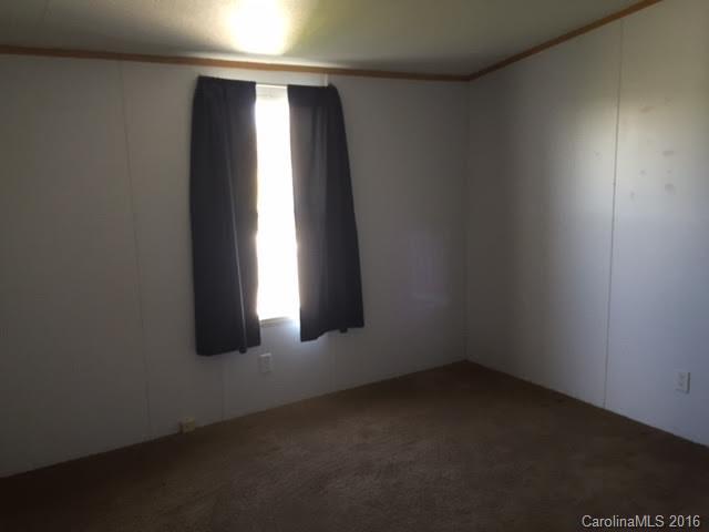 4365 Tite Road Stanfield, NC 28163 - Photo 18 of 22 an empty room with windows