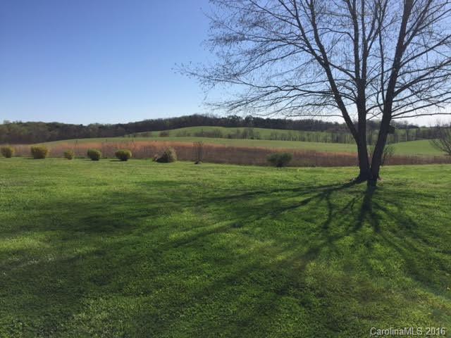 4365 Tite Road Stanfield, NC 28163 - Photo 22 of 22 a view of a lake with a yard