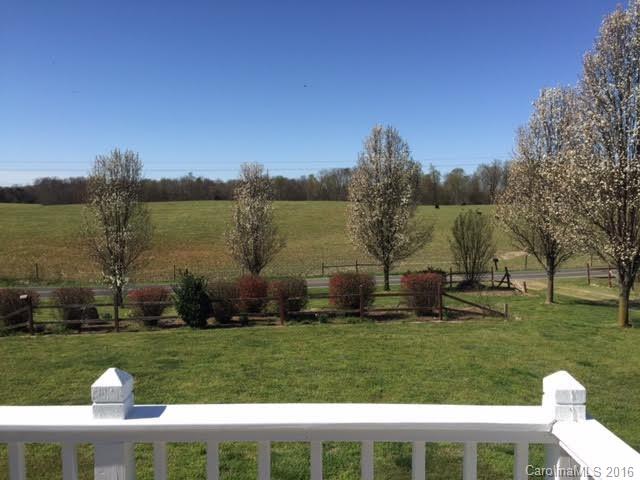 4365 Tite Road Stanfield, NC 28163 - Photo 6 of 22 a view of a table and chairs in the yard