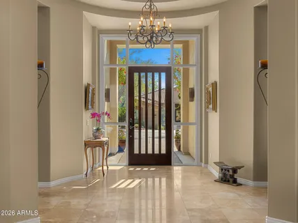 a view of a hallway with a chandelier