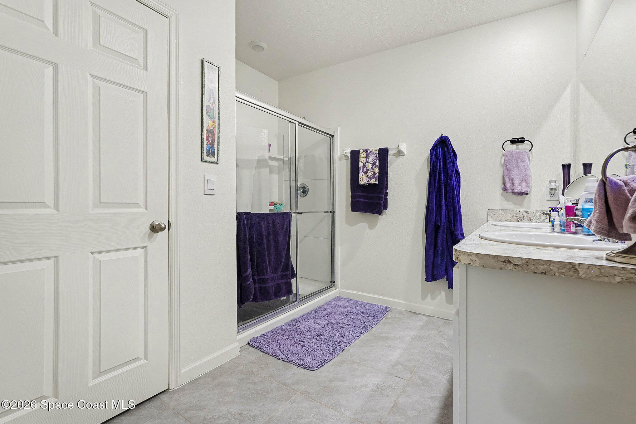 543 Old Country Rd S East Palm Bay, FL 32909 - Photo 12 of 21 a view of walk in closet with clothes and shoes