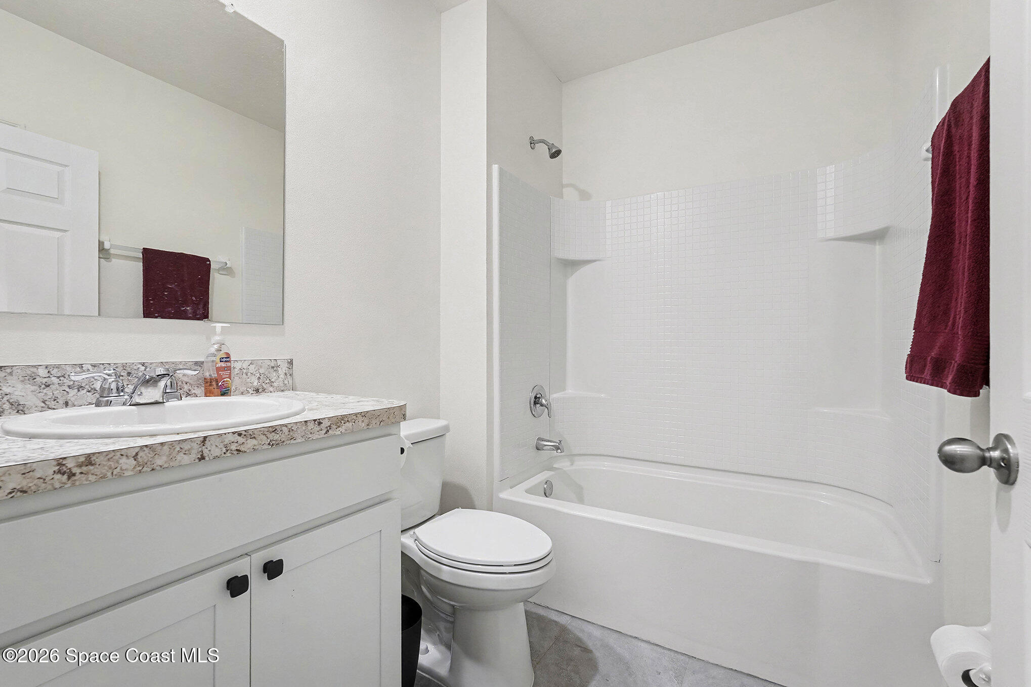 543 Old Country Rd S East Palm Bay, FL 32909 - Photo 16 of 21 a bathroom with a granite countertop sink toilet and shower