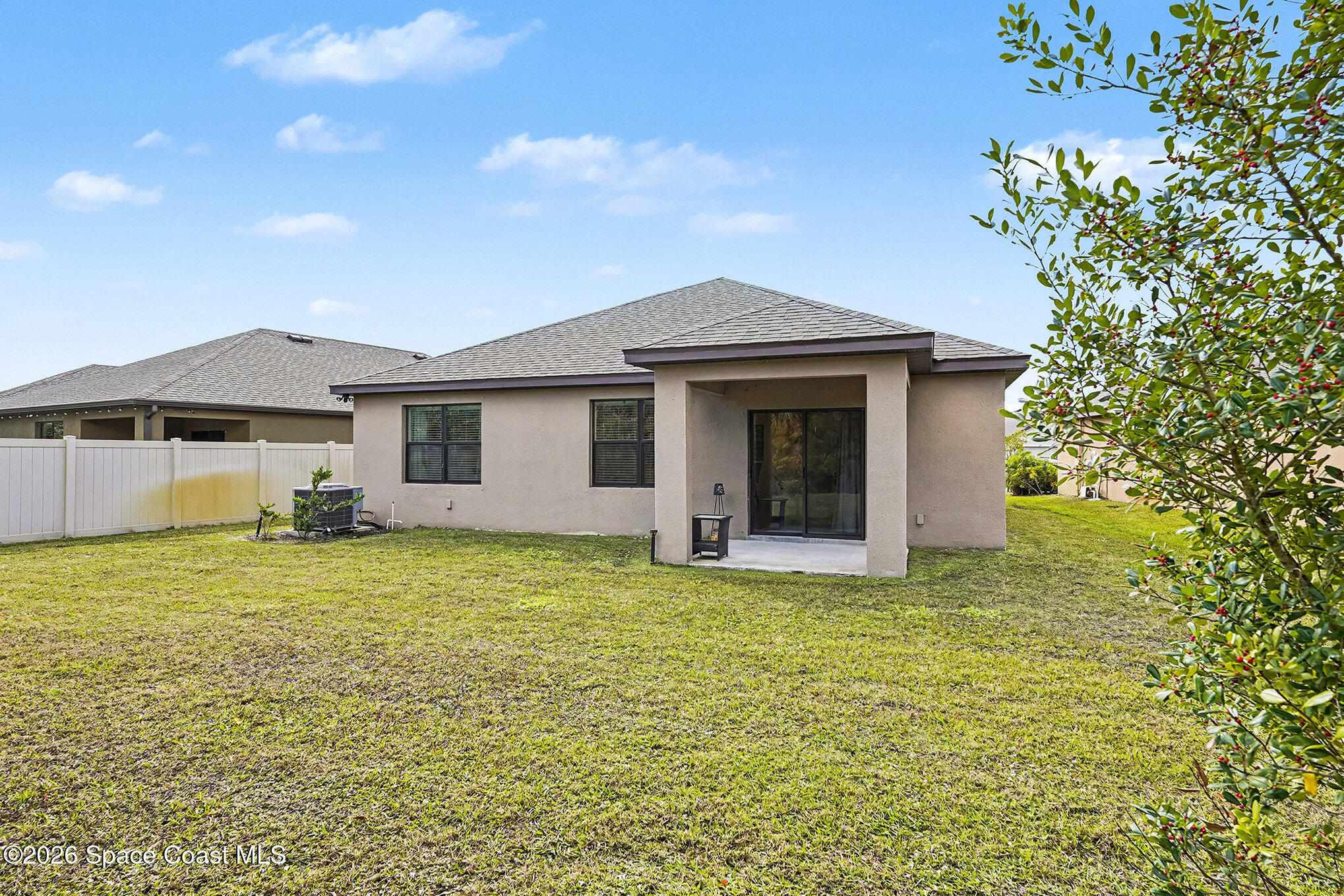 543 Old Country Rd S East Palm Bay, FL 32909 - Photo 18 of 21 a front view of a house with a garden