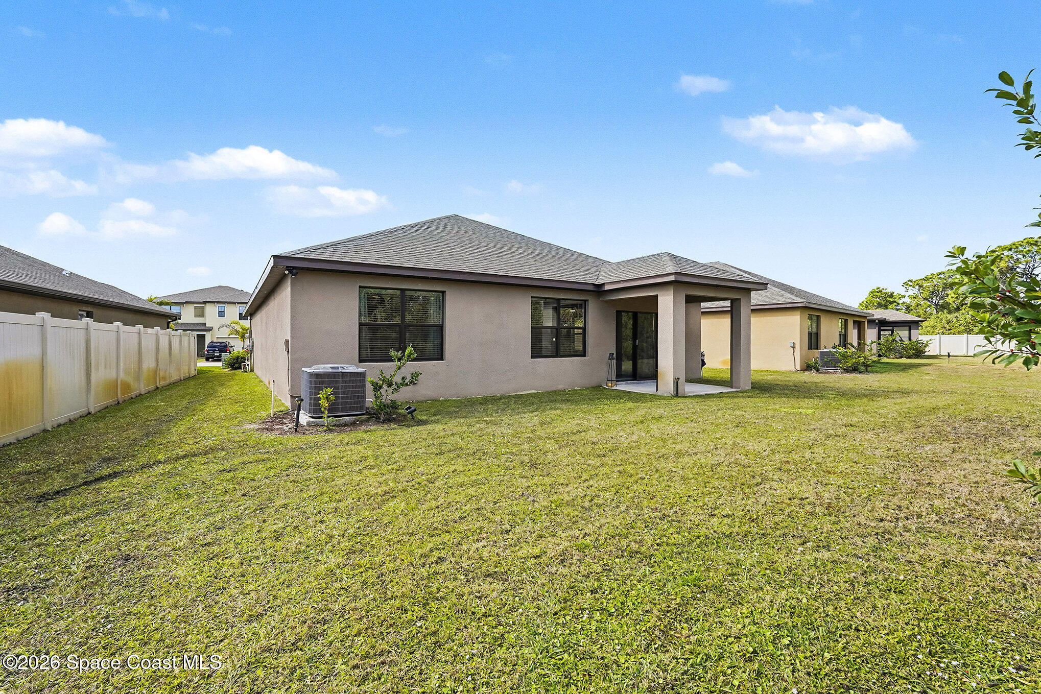 543 Old Country Rd S East Palm Bay, FL 32909 - Photo 19 of 21 a front view of a house with a yard