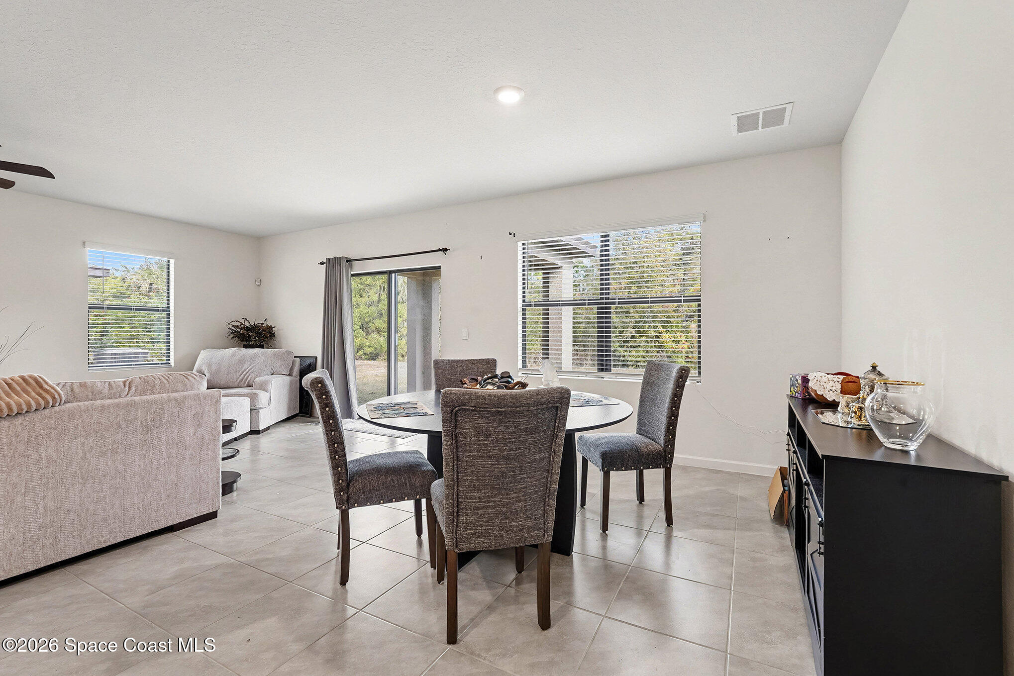 543 Old Country Rd S East Palm Bay, FL 32909 - Photo 8 of 21 a dining room with furniture and window