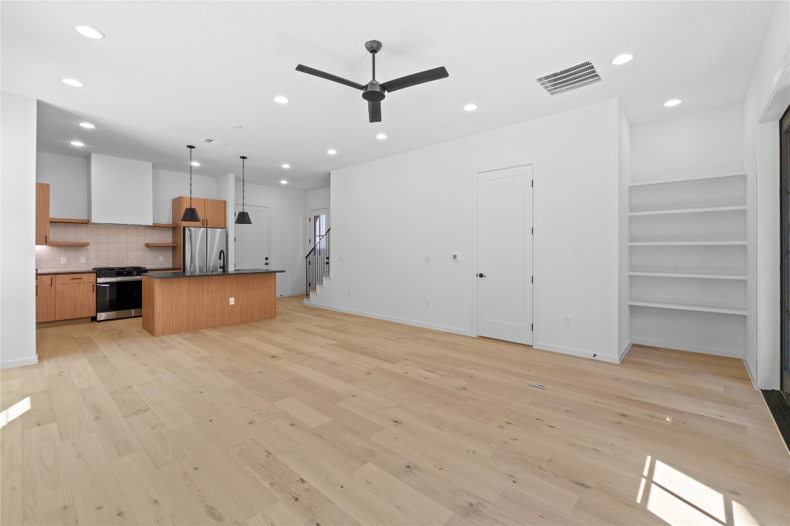 3500 Pecan Springs Road, Unit 16 Austin, TX 78723 - Photo 6 of 18 a view of kitchen and kitchen with microwave