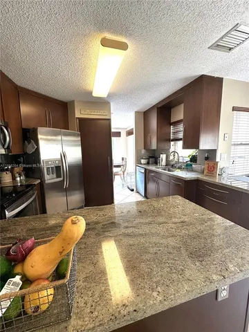 $684,900 | 9942 Northwest 29th Street, Doral, FL 33172