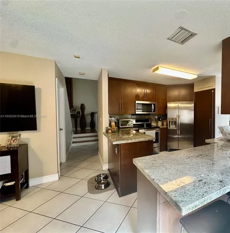 $684,900 | 9942 Northwest 29th Street, Doral, FL 33172