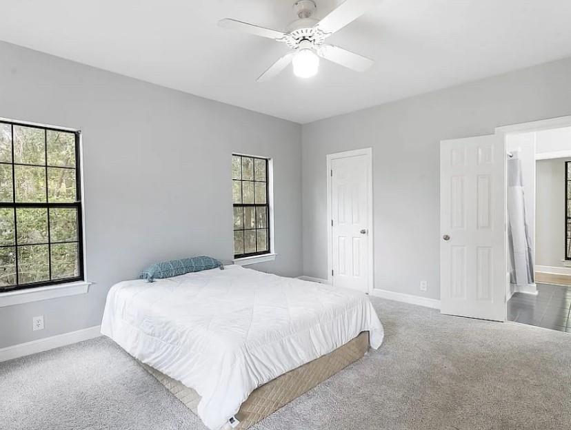 1525 Black Island Road Darien, GA 31305 - Photo 23 of 41 a bedroom with a large bed and a window
