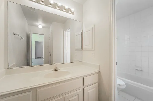 a bathroom with a sink a toilet and a bathtub