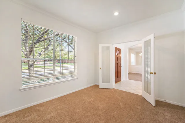 a view of an empty room with a window