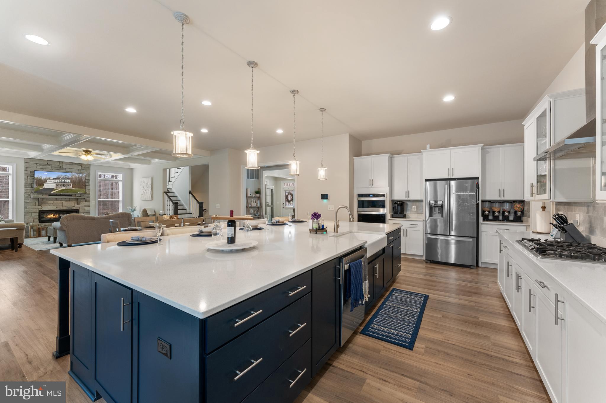 13882 Trinity Pond Lane Manassas, VA 20112 - Photo 15 of 69 a large kitchen with kitchen island a sink a counter top stainless steel appliances and cabinets